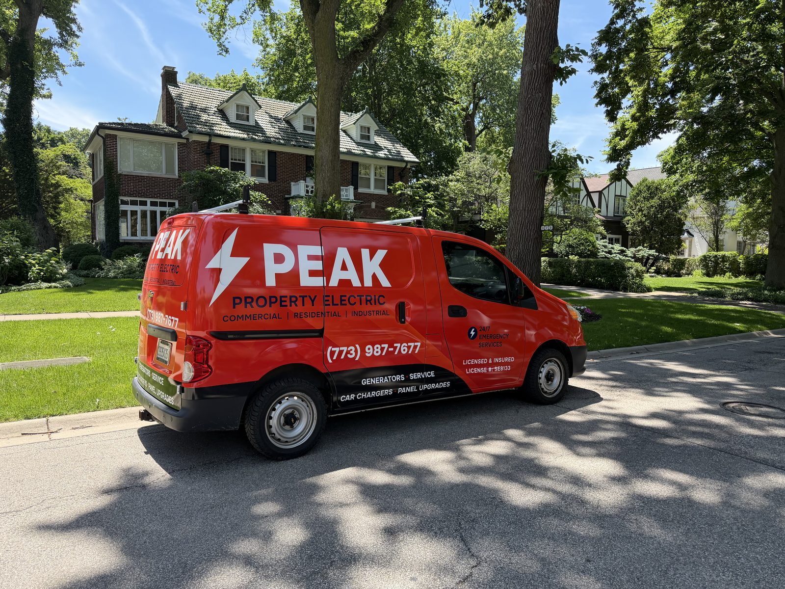Peak Property Electric branded service van in a Skokie neighborhood